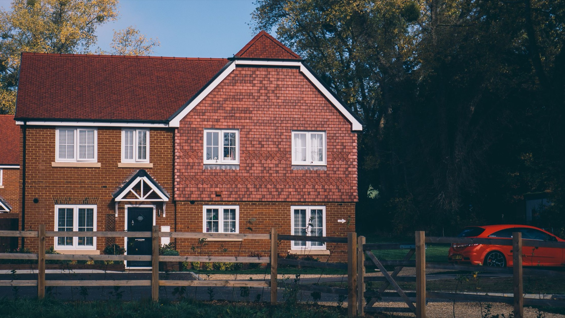 A red-brick English family house with tiled gables, of the kind we extend and renovate